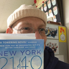Professor Peter Kipp holding his recommendation book, “New York 2140.” Photo provided by Peter Kipp