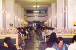Students share a moment of intimacy while eating together at the student cafeteria during the official lunch time 20 years ago.