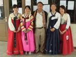 Ewha students in the KIV program pose with the principal of the school on Korean Night.