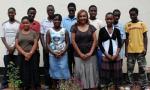 Marie Da Silva poses with Jacaranda Foundation’s 2010 Secondary School graduates who are planning to go to college.