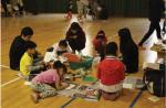 Members of Art & Sharing are doing the art education program to community children on May 12.