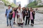 Course 1 meets a man in traditional Korean outfit at Cheonggyecheon.