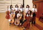 Yoon (bottom right) and Shin (bottom center) pose with their cellos along with a few other members of Ewha Celli.